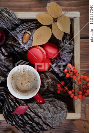 Festive autumn decor from pumpkins, berries and leaves on a white wooden background. Concept of Thanksgiving day or Halloween. Flat lay autumn composition with copy space. 118137040