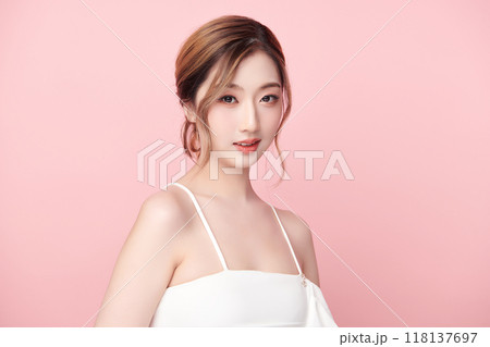 Beautiful young asian woman with clean fresh skin on pink background, Face care, Facial treatment, Cosmetology, beauty and spa, Asian women portrait. 118137697