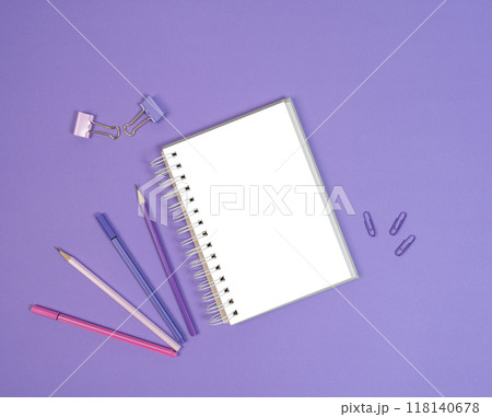 Open blank cketchbook, liners and pencils on purple background. Copy space, flat lay Open blank cketchbook, liners and pencils on purple background. Copy space, flat lay 118140678
