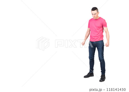 Nervous young man clenching fists in white studio Nervous young man clenching fists in white studio 118141430