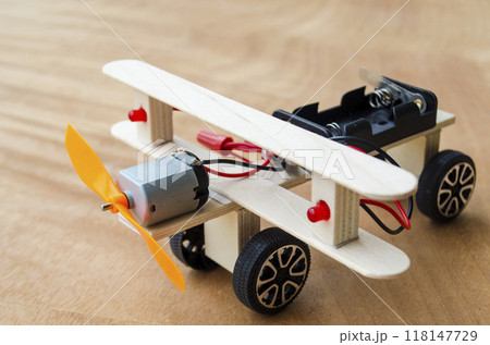 Do It Yourself toy airplane made by wooden sticks and DC motor. DIY concept. 118147729