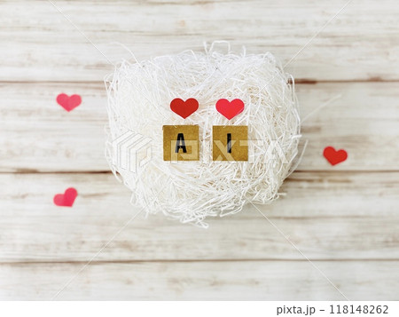 ハート型の紙とAIの文字_白い紙パッキンの上 118148262