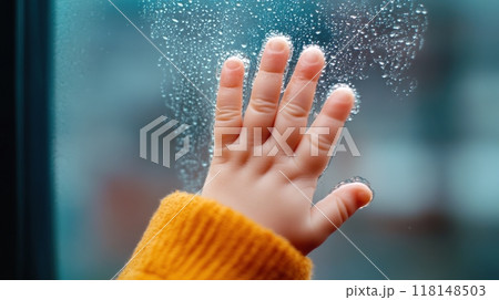 A child's hand reaching out to touch a window covered in water, AI 118148503
