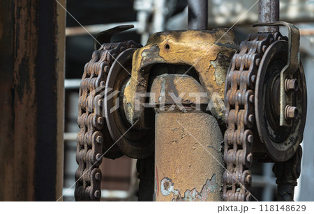 Close-up of Rusty chain on old forklift truck and lifting hydraulic cylinder. Close-up of Rusty chain on old forklift truck and lifting hydraulic cylinder. 118148629