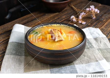 Pea Soup with Smoked Meats in Bowl on a Wooden Table Pea Soup with Smoked Meats in Bowl on a Wooden Table 118149153