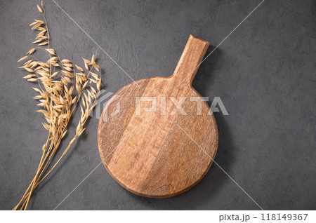 Empty wooden board on dark texture background with dry branch. Empty wooden board on dark texture background with dry branch. 118149367