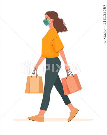 A woman wearing a medical mask, walking and shopping with several bags in her hands. 118152567