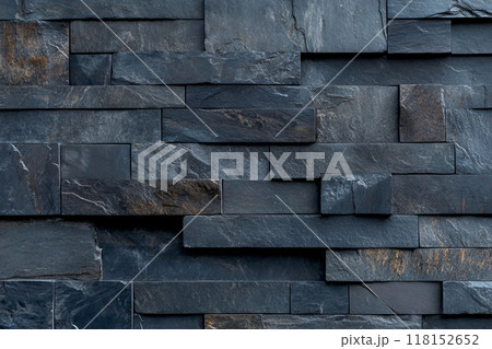 Dark gray slate wall cladding background, the texture of a natural stone panel for interior or exterior decoration. Dark gray slate wall cladding background, the texture of a natural stone panel for interior or exterior decoration. 118152652