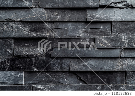 Dark gray slate wall cladding background, the texture of a natural stone panel for interior or exterior decoration. Dark gray slate wall cladding background, the texture of a natural stone panel for interior or exterior decoration. 118152658