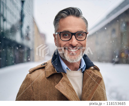 Winter Portrait of Happy Handsome Man Smiling Outdoors 118153685