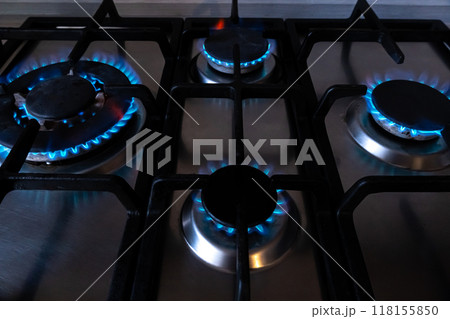 Blue fuel burns in a gas stove burner. Strategic natural gas reserves. Liquefied methane, butane or propane gas. Natural resources. Fire Blue fuel burns in a gas stove burner. Strategic natural gas reserves. Liquefied methane, butane or propane gas. Natural resources. Fire 118155850