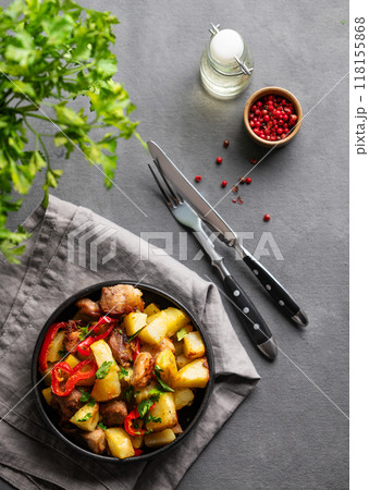 Fried pork meat with potatoes, onions and peppers. National homemade Georgian dish ojakhuri 118155868