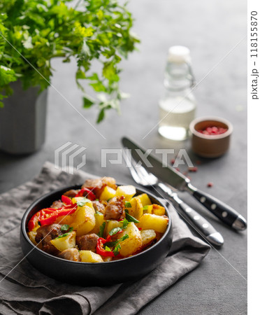 Fried pork meat with potatoes, onions and peppers. National homemade Georgian dish ojakhuri 118155870