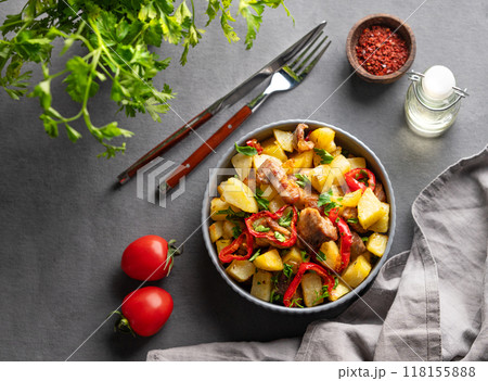 Fried pork meat with potatoes, onions and peppers. National homemade Georgian dish ojakhuri 118155888