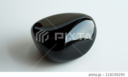 Polished Obsidian Gemstone CloseUp on White Background for Jewelry Design or Geology 118156293