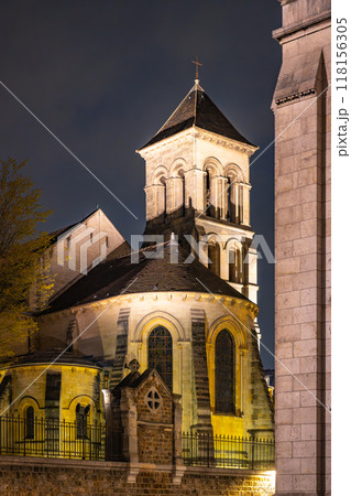 The Church of Saint-Pierre de Montmartre is illuminated under the night sky, showcasing its architectural beauty in Paris, France. The Church of Saint-Pierre de Montmartre is illuminated under the night sky, showcasing its architectural beauty in Paris, France. 118156305