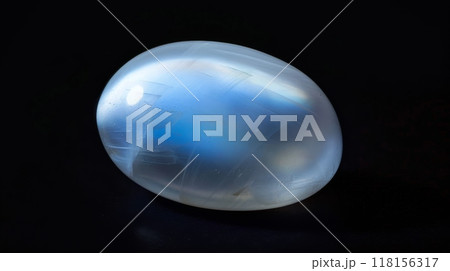 Polished Moonstone Gemstone on Black Background for Jewelry Design and Crystal Healing 118156317