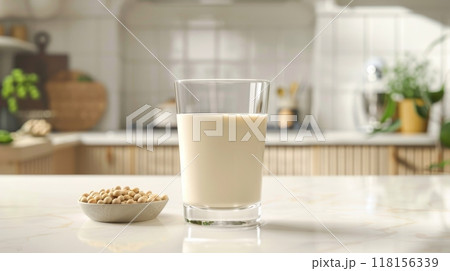 Fresh Soy Milk in a Clear Glass on Modern Kitchen Counter. PlantBased Beverage for Health and Nutrition. High Quality Stock Photo for Culinary Design and Promotion. 118156339