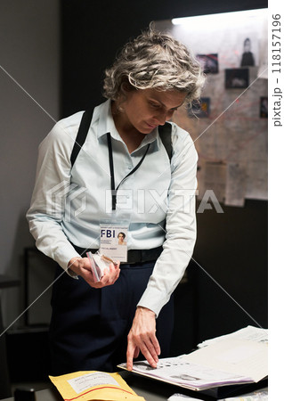 Examining Documents in an FBI Investigation Office Examining Documents in an FBI Investigation Office 118157196