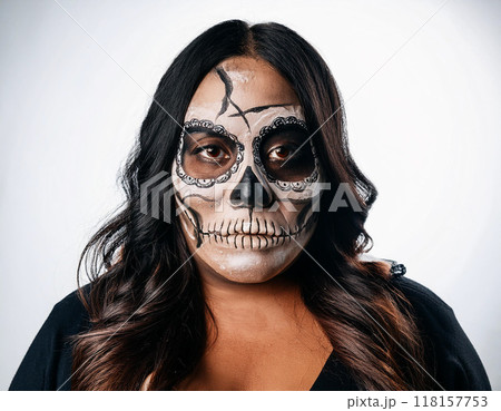 Woman in Skull and Bone Mask Day of the Dead Concept 118157753
