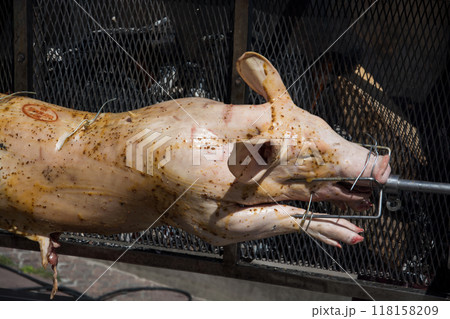 Closeup of roasted pig in barbecue in outdoor 118158209