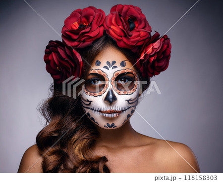 Day of the Dead Portrait of Woman with Skull and Bone Mask and Floral Hair Elements Day of the Dead Portrait of Woman with Skull and Bone Mask and Floral Hair Elements 118158303