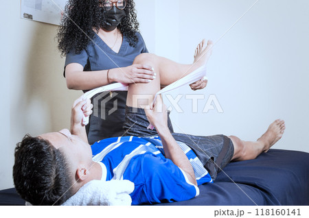 Knee Wrap Physiotherapy, Knee Strengthening Physiotherapy, Neuromuscular Bandage Treatment. Physiotherapy exercises for knee strengthening Knee Wrap Physiotherapy, Knee Strengthening Physiotherapy, Neuromuscular Bandage Treatment. Physiotherapy exercises for knee strengthening 118160141