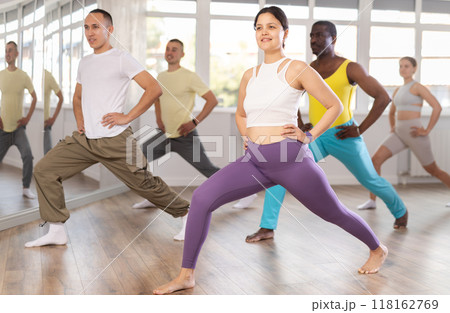 Group of people warming up before dance class 118162769