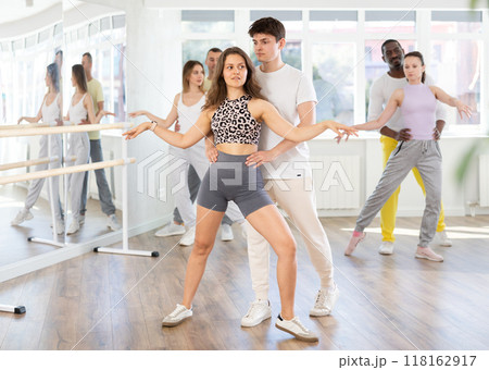Young couple practicing passionate samba in dance class 118162917