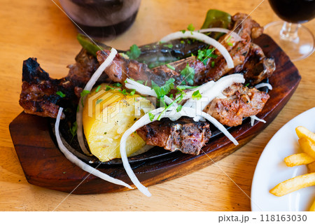 Lamb ribs with potato and vegetables Lamb ribs with potato and vegetables 118163030