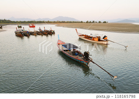 Small fishing boats anchored in the sea Small fishing boats anchored in the sea 118165798
