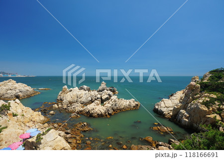 Rocky beach scenery with ocean horizon Rocky beach scenery with ocean horizon 118166691