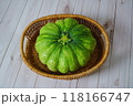 green pumpkin on a white wooden background 118166747