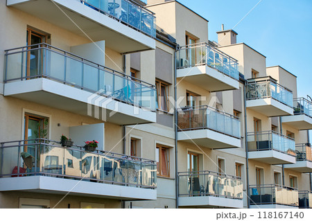 Multi story apartment building exterior. Residential building facade with balconies at summer day. Modern residential architecture in European city 118167140