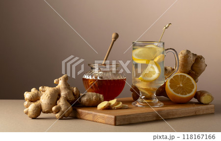 Ginger tea with lemon and honey on a beige background. Ginger tea with lemon and honey on a beige background. 118167166