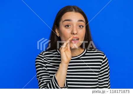 Young woman whisper news rumors holding hands near mouth, share gossip, quiet, keep my secrets Young woman whisper news rumors holding hands near mouth, share gossip, quiet, keep my secrets 118171873