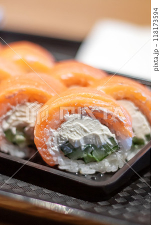 A tray of sushi served with ginger and wasabi on the side A tray of sushi served with ginger and wasabi on the side 118173594