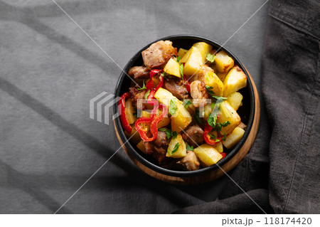 Fried pork meat with potatoes, onions and peppers. National homemade Georgian dish ojakhuri  118174420