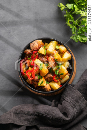Fried pork meat with potatoes, onions and peppers. National homemade Georgian dish ojakhuri  118174424