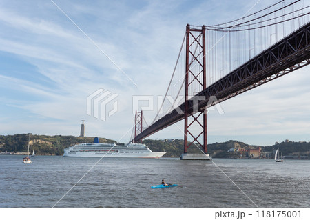 Cruise ship passing under the 25 de abril bridge in lisbon Cruise ship passing under the 25 de abril bridge in lisbon 118175001