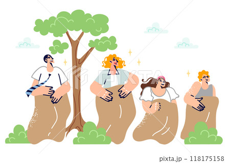 Family participates in sack race together, having fun in their free time in park, in fresh air 118175158
