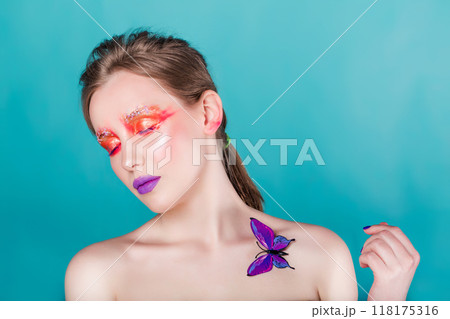 Woman with Colorful Makeup and Artificial Butterfly Woman with Colorful Makeup and Artificial Butterfly 118175316