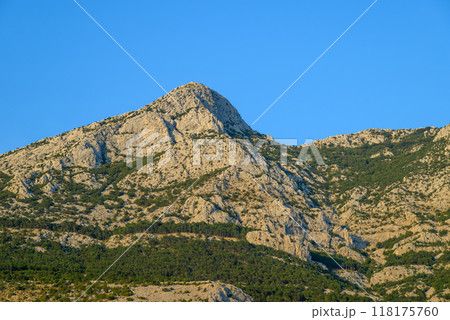 View of the Biokovo mountain range of the Dinaric Alps from Makarska riviera, Adriatic coast of Croatia 118175760