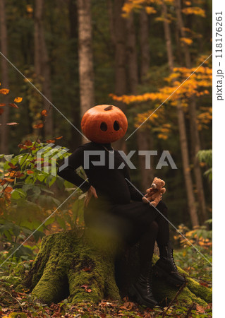 Surreal Pumpkin Head in Autumn Forest Surreal Pumpkin Head in Autumn Forest 118176261