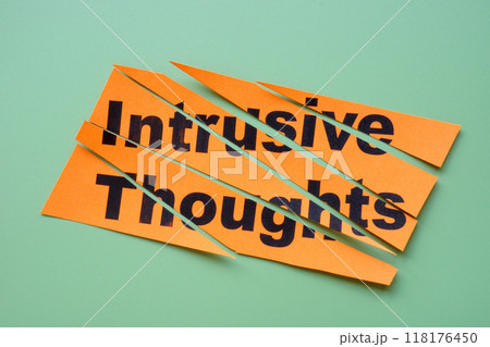 Cut paper with the label intrusive thoughts. Cut paper with the label intrusive thoughts. 118176450