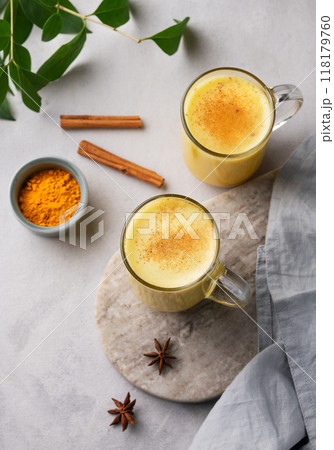 Turmeric golden milk latte with spices and honey. Detox, immunity boosting, anti-inflammatory Turmeric golden milk latte with spices and honey. Detox, immunity boosting, anti-inflammatory 118179760