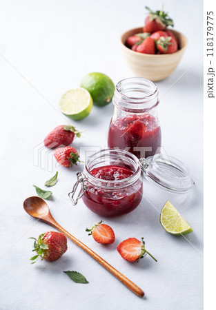 Homemade strawberry jam. Preserved food in a glass jar with fresh organic berries Homemade strawberry jam. Preserved food in a glass jar with fresh organic berries 118179775
