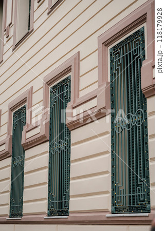metal bars on the windows of the building on the top floor metal bars on the windows of the building on the top floor 118179928