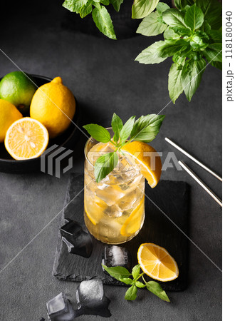 Lemonade drink with fresh lemon, lime, mint and ice. Refreshing citrus mojito cocktail  118180040