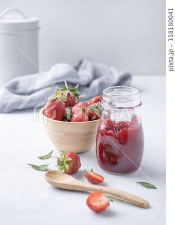 Homemade strawberry jam. Preserved food in a glass jar with fresh organic berries  118180041